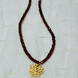Elegant Gold and Garnet Lotus Pendant Necklace